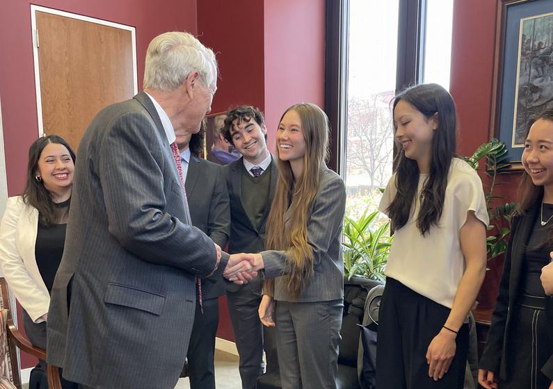 Ashley shaking Angus King's hand